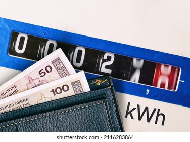 wallet with bosnian convertible mark paper money and electricity meter measures - Shutterstock ID 2116283864
