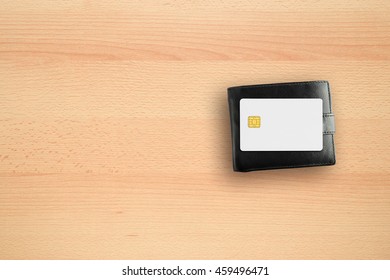 Wallet And Credit Card On Office Desk