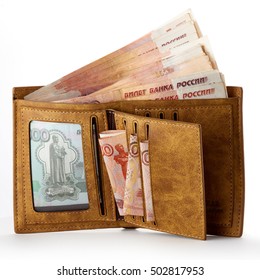 Wallet full of money. Big salary. Isolated object on white.