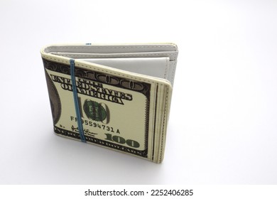 Wallet with fun American Dollar banknote print on it in front of white background creative utility gadget concept for stock and fund investments credit debt and debit money loan and finances articles