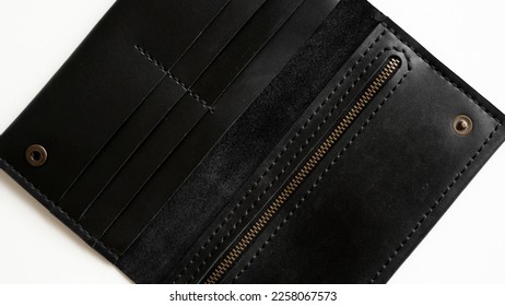 Wallet made of genuine black leather with a slots for cards and big zip pocket on a white background. Accessories for men. - Shutterstock ID 2258067573