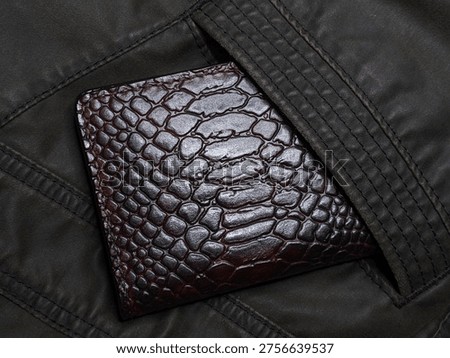 a wallet made of genuine python leather, which is a stylish accessory