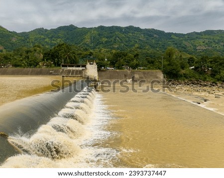 A wall-like structure to block the flow of water through the landscape. Lumbayao Dam in Valencia, Bukidnon. Philippines.