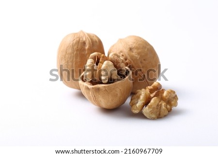 Wallnuts  brain  nuts  shell isolated on white background. Raw  nut  cracked  wallnut snack food  ingredient