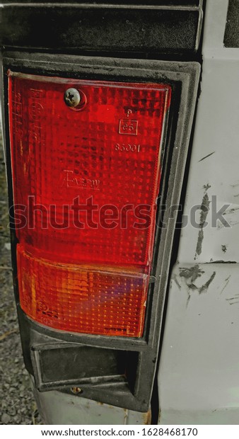 Wallpaper of a car\
from back showing tail\
light.