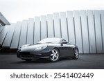 Wallpaper of German Two Seater Convertible Sports Car with a studio like background