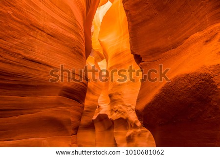 The walls of the the canyon glow when illuminated by the morning sun in lower Antelope Canyon, Page, Arizona