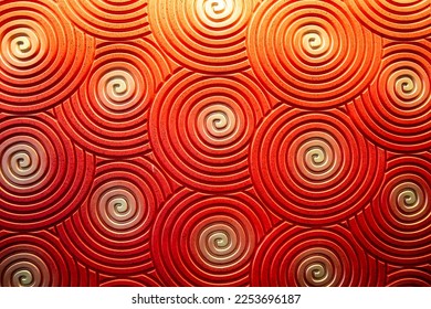 The walls are colored red, orange, and yellow and have spiral-like swirl lines. - Shutterstock ID 2253696187