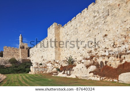Walls of eternal Jerusalem. The sunset softly shines ancient walls and David's Tower