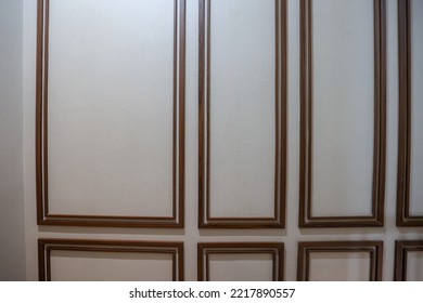 The Walls Of The House That Are Beautified With Wood Trim