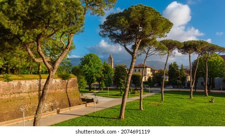 The Walls of Lucca public park. View of St Mary Bulwark and St Condordio gothic bell tower - Shutterstock ID 2074691119