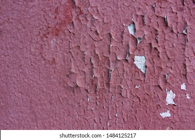 The Walls Of The Old House Red Color Cracked. Cracked Plaster As A Background Or Texture. Old Painting Cracked.