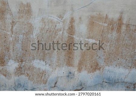 the walls whose paint has become dull and faded.
