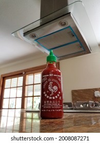 Walnut, CA, United States, 7-14-21: Sriracha Bottle In Kitchen Next To Stove