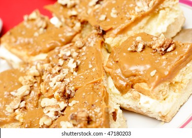 Walnut Carmel Cake On A White Plate