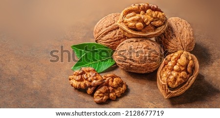Walnut. Fresh Walnut kernel Nut  on wooden background with copyspace. Top view. 