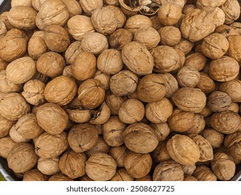 Walnut isolated unpeeled walnuts. Walnut nut with shell.
Full depth of field. Walnuts close up. Pile of nuts, close-up background. - Powered by Shutterstock