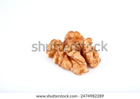 Walnut kernel, Closeup of big shelled walnuts pile. Top view of bunch of nutrient fresh walnuts without shell isolated on white background.