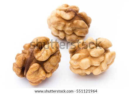 Walnut and walnut kernel isolated on the white background.