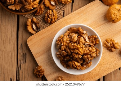 Walnut kernel and whole walnuts on a plate.Healthy Fats,Support weight management.Top view. - Powered by Shutterstock