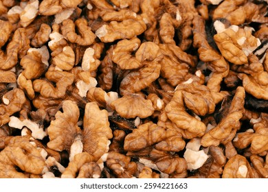 Walnut kernels isolated on white background. Walnuts close-up. Healthy eating. Half of walnut isolated. Peeled walnut on white.
