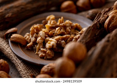 Walnut kernels and whole walnuts on a table.
Image of organic walnuts. - Powered by Shutterstock