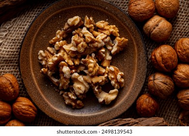 Walnut kernels and whole walnuts on a table.
Image of organic walnuts.