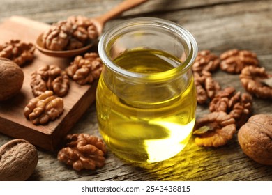 Walnut oil in jar and ingredients on wooden table, closeup - Powered by Shutterstock