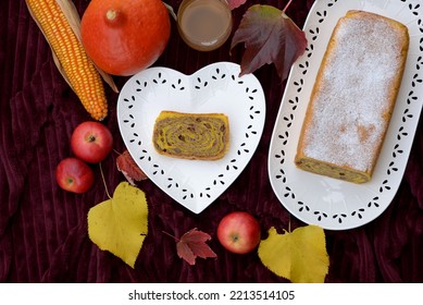 Walnut Roll With Raisins. Bread Texture Of Home Baked Potica, Sweet Bread Roll With Walnuts In Pumpkin Dough. Slice Of Pumpkin Bread Cake Stuffed With Walnuts And Raisins On White Plate.