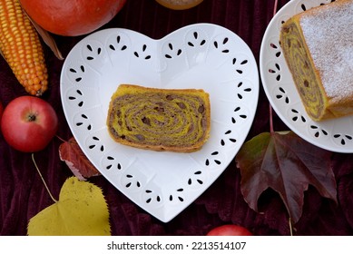 Walnut Roll With Raisins. Bread Texture Of Home Baked Potica, Sweet Bread Roll With Walnuts In Pumpkin Dough. Slice Of Pumpkin Bread Cake Stuffed With Walnuts And Raisins On White Plate.