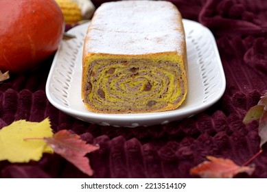 Walnut Roll With Raisins. Bread Texture Of Home Baked Potica, Sweet Bread Roll With Walnuts In Pumpkin Dough. Pumpkin Bread Cake Stuffed With Walnuts And Raisins On White Plate.