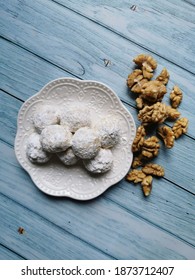 Walnut Snowball Cookies On A White Plate