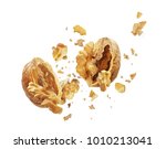 Walnut is torn to pieces on white background 
