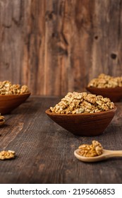 Walnut In Wood Bowl On Kitchen Table