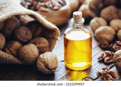 Walnuts. Bottle of essential nut oil, sack of walnuts.
