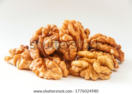 Walnuts, a bunch of peeled walnuts on a white background.