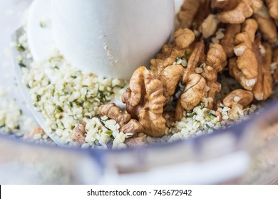 Walnuts And Hemp Seeds In The Bowl Of A Food Processor