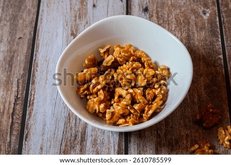 Walnuts are nutrient-rich nuts with a hard shell, offering healthy fats, antioxidants, and brain-boosting benefits in a crunchy bite.