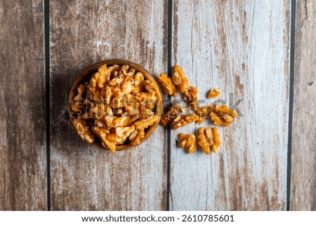 Walnuts are nutrient-rich nuts with a hard shell, offering healthy fats, antioxidants, and brain-boosting benefits in a crunchy bite.