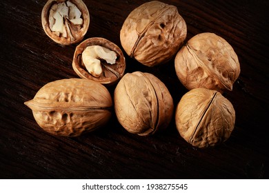 walnuts on dark brown wood wood surface