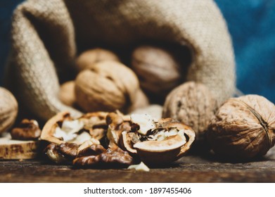 Walnuts on a dark vintage wooden table, Walnuts in a bag, Walnuts healthy food - Shutterstock ID 1897455406