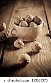Walnuts on wooden boards. Vintage Retouch. - Shutterstock ID 153583370