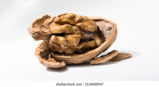 Walnuts are rounded, single-seeded stone fruits of the walnut tree. Cracking a nut.