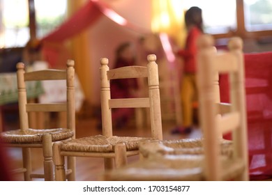 Walrdorf pedagogy doll in a wooden kitchen for children.
