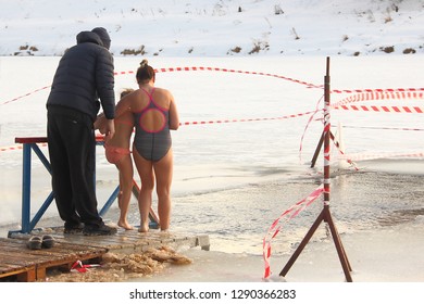 Walrus Family Swimming In Cold Water In The Fenced Ice Hole In Winter - Winter Sports, Healthcare, HLS, Rear View