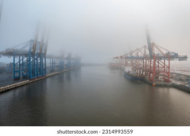 the waltershofer harbor in hamburg on a foggy day - Powered by Shutterstock