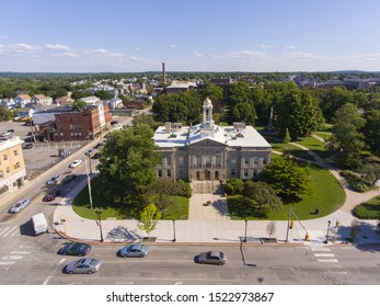 Waltham City Hall And Downtown With Boston Skyline At The Background Aerial View In Downtown Waltham, Massachusetts, MA, USA.