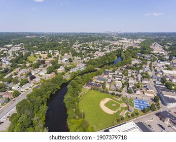 Waltham Historic City Center And Charles River Aerial View With Boston City Skyline At The Background, Waltham, Massachusetts MA, USA. 