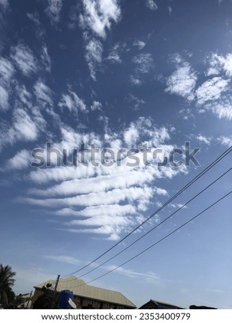 A wandering cloud on a bright sunny day