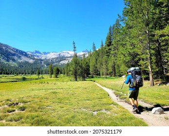 Wanderlust Explorer Participating In  Ultralight Backpacking Through Mountains And Yosemite National Park On Long Hiking Journey And Adventure Of The John Muir Trail 